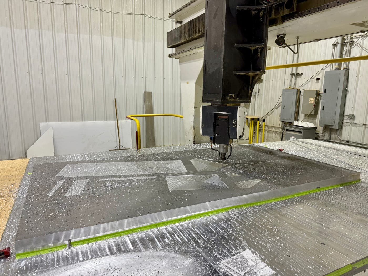 Large aluminum panel on a gantry CNC machine at Werco